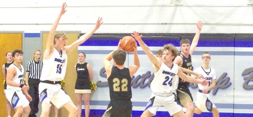 Harper Johnson (#24) and Carter Wood (#15) put pressure on the Spartans.