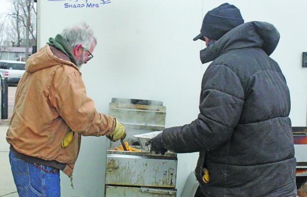 Henry Lindner and Cole Tierney of Broken Bow manned the fish fryer in Callaway on March 6 for the Lenten Fish Fry. The event rotates each week to the different Custer County communities.
