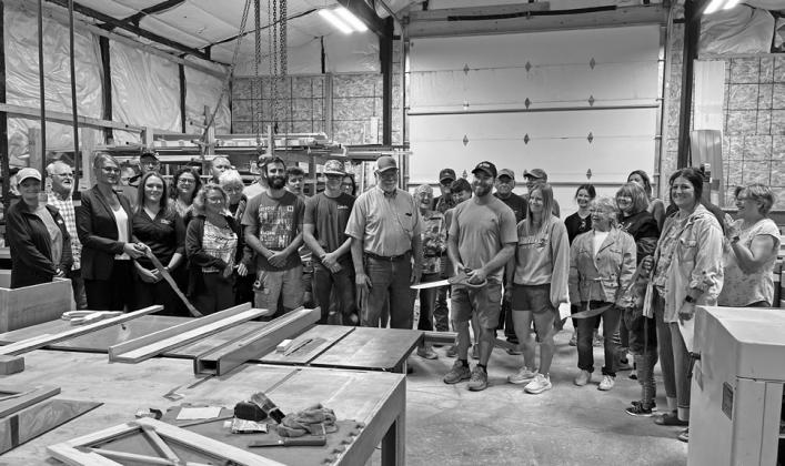 On Tuesday, Aug. 4. the Callaway Chamber of Commerce hosted a ribbon cutting for Kennedy Construction &amp; Woodworks. The business is owned by Bryson Kennedy. A large group of Chamber, community, and family members joined Bryson and Traci Kennedy in congratulating them on the new Callaway business. (Photo courtesy Kelsey Wyckoff)