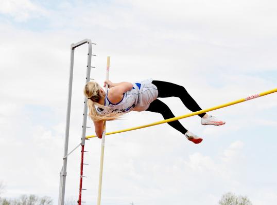 Bryn Schwarz won the Dave Blevins Invite with not one PR but two in the pole vault - first clearing the bar at 8' 6 then at an even 9'. (Courier photo by Loleta Connell)