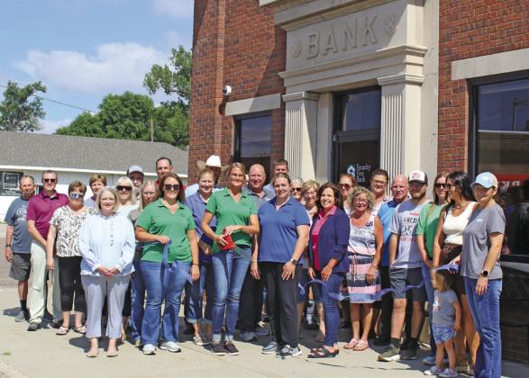 Stacey Guthard, Vice President of Callaway’s Security First Bank, was joined by her team and members of the community as she cut the ribbon welcoming new ownership. (Leader photos by Ellen Mortensen)