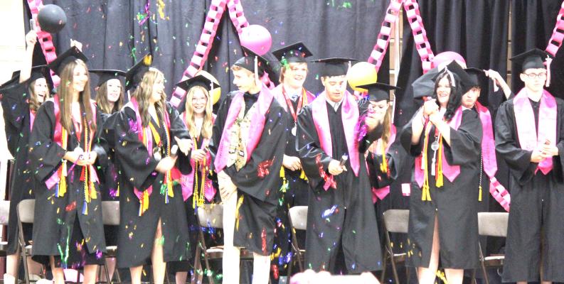 ABOVE: The Callaway High School Class of 2024 celebrates at the conclusion of Sunday's graduation ceremony with colorful confetti. (Courier photos by Ellen Mortensen)