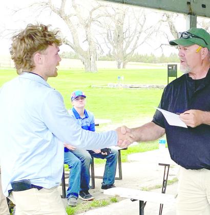 ABOVE: Harper Johnson is awarded the 6th place individual medal at Sandhills/Thedford last week. LEFT: South Loup JV golfers Callan Witthuhn, left, earned the silver medal at Monday's tournament in Arnold while Asher Evans finished 5th overall. (Photos courtesy Coach Jeff Cole)