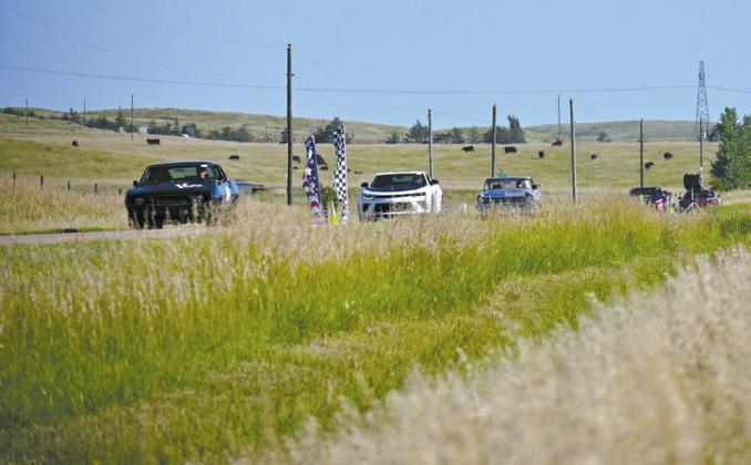 A line of race cars comes back across the hills, returning from the first round of the half-mile and one-mile shootout. (Photos courtesy Jessica Tickle)