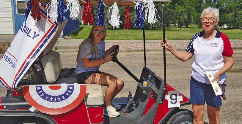 Representing the Callaway American Legion Auxiliary in the Oconto Fun Day Parade are junior member Lauren Reiff, driving, and member Mary Ann Boldt. Erin Reiff also walked with the entry.