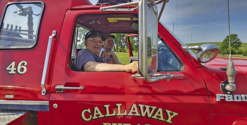 Kyle Wise and Larry Franssen are seen in the Callaway Rural Fire Department’s 1989 Ford Pumper at the Oconto Fun Day Parade Saturday, July 4.