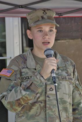 US Army PFC Brynn Eggleston sings the National Anthem at the start of the parade in Oconto July 4.