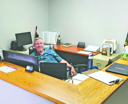 Mike Wendorff mans the Callaway District Hospital transportation office at its new downtown location. The renovated building also now houses interns and traveling staff for the hospital, with three available bedrooms. (Courier photo by Ellen Mortensen)