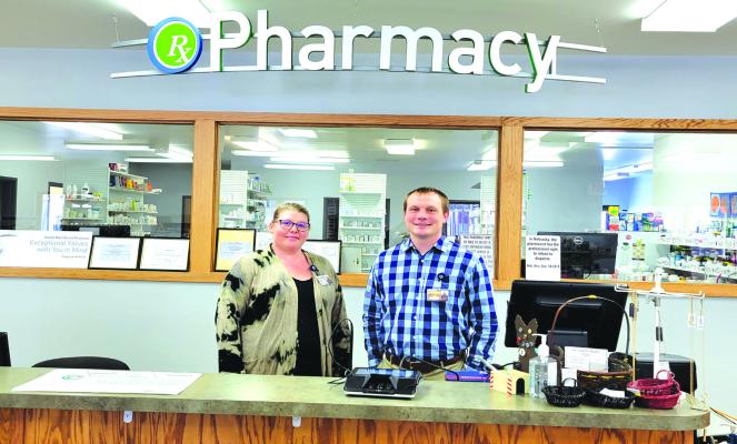 Pharmacist Drew Smith, right, and pharmacy tech Brooke Dickman are ready to provide full-time pharmaceutical services at South Loup Community Pharmacy in Callaway. (Courier photo by Ellen Mortensen)