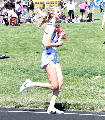 ABOVE LEFT: Freshman Elijah Cool brought home 5th place in the 800m dash at the Burwell Invite last week with a time of 2:16.80. ABOVE RIGHT: Junior Ella Cool won gold in the 3200m run at Burwell crossing the finish line at 13:37.64. (Courier photos by Loleta Connell)