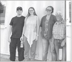 From left, German volunteer firefighter, Darius Sehrt, his wife, Svenja, CVFD volunteer and tour guide, Amber Harrison, and host, Shirley Trout. (Photo by Jane Becker)