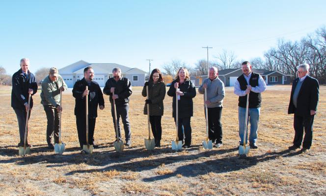 From left: Lt. Gov. Mike Foley, Sen. Tom Brewer, Jerad Reimers - office of US Congressman Adrian Smith, Callaway Village Board Chairman Mark Kimball, Morgan Pearson - NDED, Carla Kimball - CNEDD, Callaway Chamber President Ken Pitkin, Chris Smith and Keith Ellis - CEDC had the honor of breaking the ground on Dec. 6 for a new home being built in Callaway through the Affordable Housing Trust Fund.