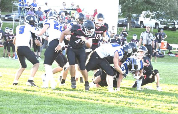 Conner Paulsen bulls his way through the line for extra yardage as the Bobcats took on Sandhills Valley last week. South Loup came out on top of the high scoring, hard-fought contest. (Courier photo by Jessica Tickle)