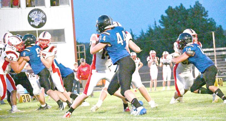 The South Loup defense Paxton Bierman #9, Crew Witthuhn #44, and Conner Paulsen #10 - try to get through the offensive line of Perkins County and get to the ball carrier. It was a tough night for the Bobcats last Friday, and they will look to avenge the loss tonight (Sept. 19) when they head to Sandhills Valley. Kickoff is set for 7 p.m. (Courier photo by Jessica Tickle)