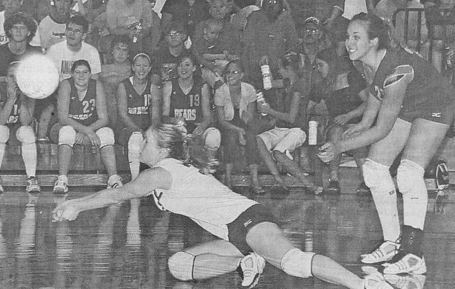 Senior libero Traci Pandorf makes a dig look easy for smiling teammate Whitney Jenkins as the Lady Bears ran past the Anselmo-Merna Lady Coyotes.