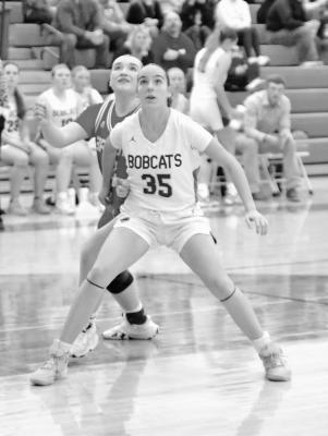 Kaygan Witthuhn watches the ball at the basket in anticipation of getting a rebound. (Courier photos by Ronda Mcfate)