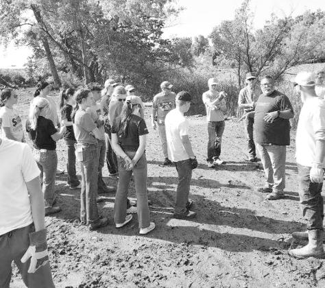 The Callaway Senior High Youth Group gathered on the property they would be spending the next couple of days working on. Here Pastor Chad of the local Oklahoma City church explains to the group his vision for the property as he thanked the group for being there. (Photo courtesy Sara Hogg)