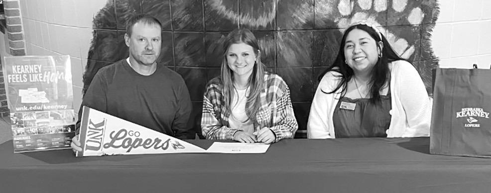 Last week Ava Pandorf, center, signed her letter of intent to attend UNK next fall. (Photo courtesy CPS)