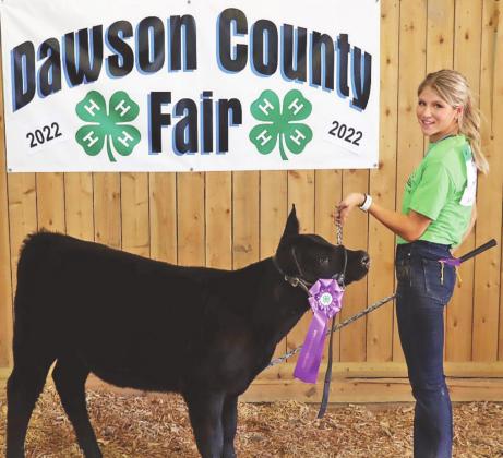 Rilyn Schledewitz, Oconto, brought home the Breeding Heifer Championship trophy and rosette.