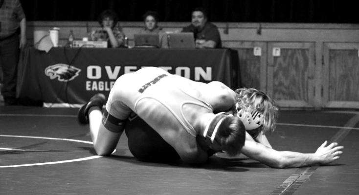 A Bobcat wrestler works hard to get his opponent rolled over duriing the team's home invite last week. (Photo courtesy South Loup Sports)