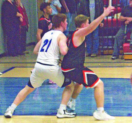 Junior Malachi Neth played tough defense against Maxwell on Jan. 16, grabbing down 2 defensive rebounds in the effort. (Photos courtesy of Ronda McFate)