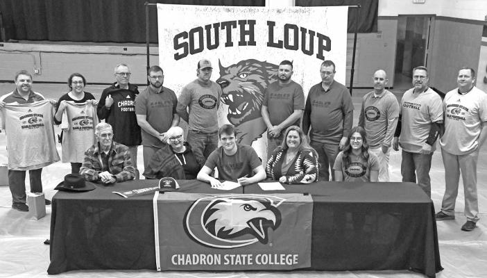 Rio Remund is moving on to the college level next year as he has signed his letter of intent to play football at Chadron State College in the fall. Celebrating with Rio at his letter signing were family members, seated, from left, grandparents Rich Hornung and Jane Hornung, Rio, his mother Holly Remund, and sister Riata Remund. Rio's high school coaches, superintendent and athletic director were also on hand for the event.