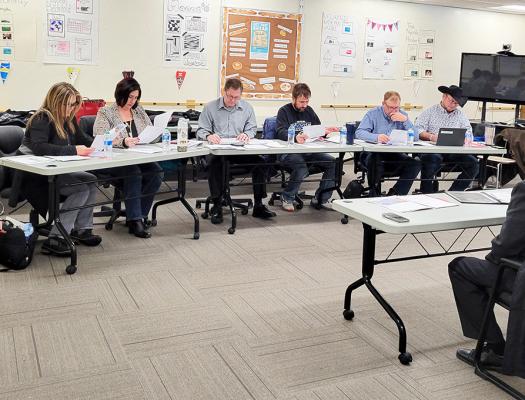 Callaway school board members, from left, Rhonda Pandorf, Liana Hrupek, Mike Reiff, Vince Guthrie, Jim Phelps, and TR Anderson conduct an interview for one of three candidate finalists for the position of Callaway superintendent on Monday, Jan. 15. (Courier photo by Ellen Mortensen)