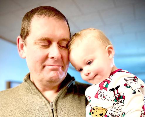 JD Furrow began his first year as superintendent of Callaway Public Schools on July 1, and is looking forward to greeting the students when the doors open for the 2024-2025 school year on Aug. 14. Until then, he is enjoying all the family time he can get and snuggles with his grandson, John. (Courtesy photo)