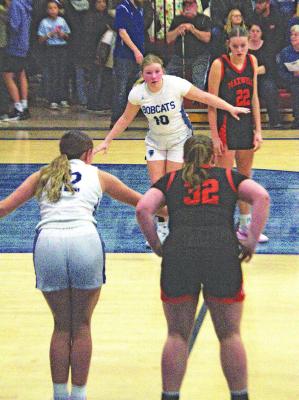 Bobcats box out: Kamryn Kramer (#12) and Tyra Brestel (#10) do their best to set up for the rebound.
