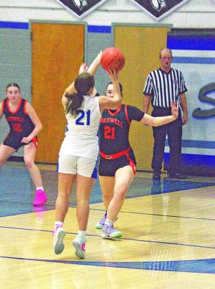 Junior Addi Stump goes up for two against Maxwell. The Lady Bobcats struggled to get offense going, but their 18 total points were spread fairly evenly across the team. (Photos courtesy Ronda McFate)