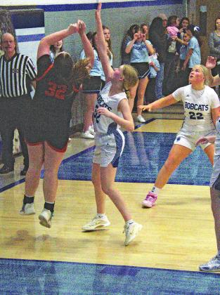Freshman Gracie Brennan takes up her position under the net as Neltje Reiff looks on. She pulled down 9 rebounds to lead the Bobcats against Maxwell.