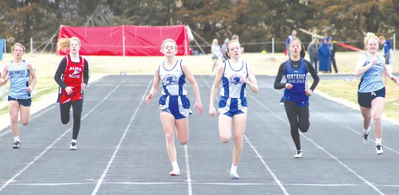 Halie Recoy and Bryn Schwarz pull hard down the stretch of the 100 meter finals on April 1 at Ellwood. Recoy and Schwarz finished first and second in the event, respectively. (Courier photo by Rebecca Steward}