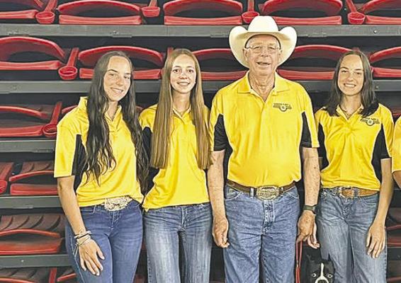 The 4-H shooting team representing Nebraska at the national competition in Grand Island included three members of the South Loup 4-H Club. From left are Kaygan Witthuhn, Josie Lehmkuhler, Coach Mike Lehmkuhler, and Kelynn Witthuhn. (Photo courtesy Nicole Witthuhn)