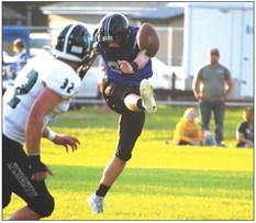 Jamie Tickle kicks off against the Knights Friday evening in Homecoming action. (Courier photos by Loleta Connell)