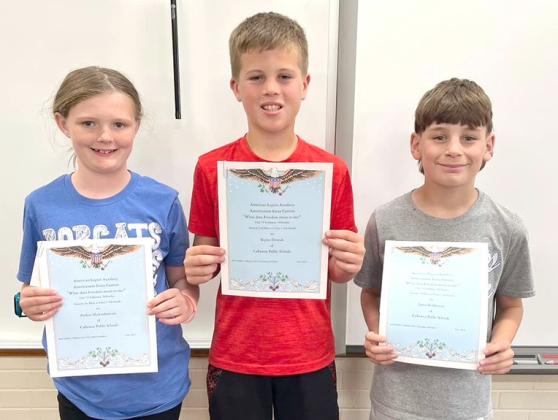 4th grade essay: From left, 1st place, Parker Hickenbottom, 2nd place, Skylar Dvorak, and 3rd place, Jaxon Fedderson.