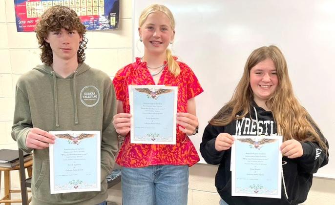 8th grade essay: From left, 2nd place; Patrick Eggleston, 1st place; Emma Stallbaumer, and 3rd place, Chloe Bloomer.