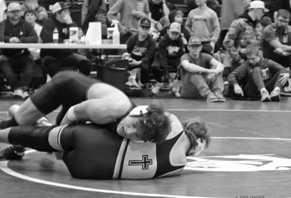 Ryan Lords is giving his all as he attempts to get his opponent on his back for a pin.