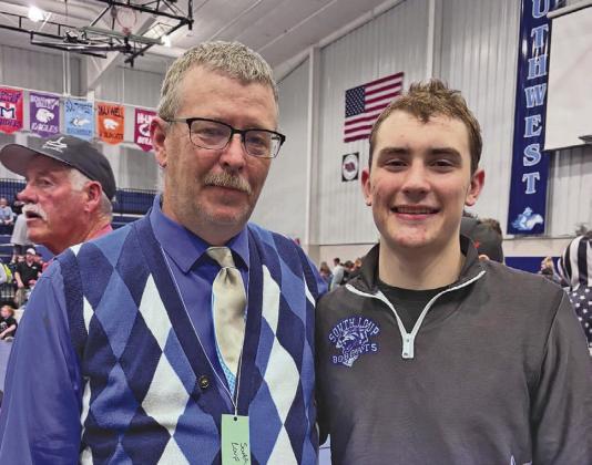 Shown here with one of his qualifiers, Paxton Bierman, coach Todd Phelps is all smiles after his two senior leaders ended up on the podium. (Photo courtesy of Leron Bierman)