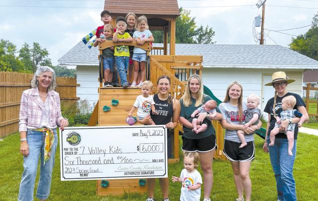 The 7 Valley Kids Daycare received a $6,000 grant from the Custer County Foundation for playground equipment. Pictured with the kiddos are, from left, Julianna Jenkins, Kendra Meyer, Haylea Rynearson, Katie Mason, and Meghan G’Schwind. (Photo courtesy Lindsay Cook)