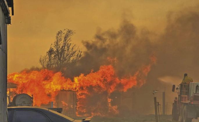 Sara Hogg snapped this photo from her yard as volunteer firefighters fought to save her home. They lost the garden shed, but are very grateful that their house still stands, thanks to the efforts of the Callaway Volunteer Fire Department.