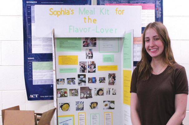 Sophia Doyle will have to take apart her display board and reassemble it when she arrives in San Diego for National FCCLA. (Courier photo by Ellen Mortensen)