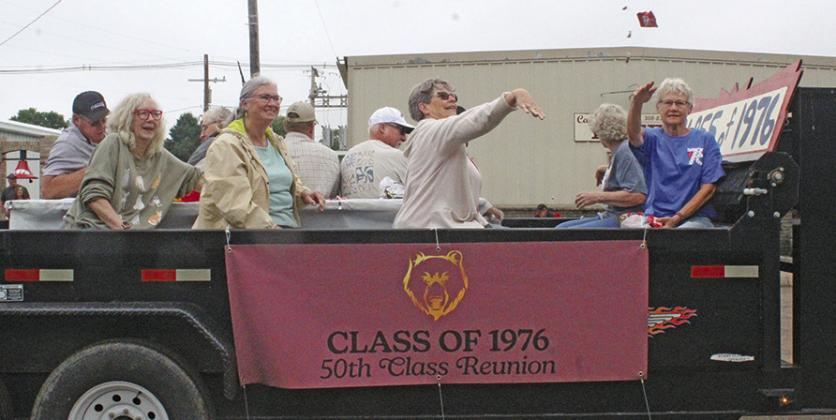 The ladies of the CHS Class of 1976 shared laughs while throwing candy to the kids during the Pioneer Picnic parade, while the guys were distracted yucking it up! (Photo courtesy Janel Brestel)