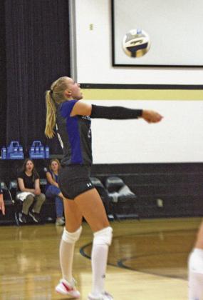 Addison Dalrymple plays the ball in a South Loup match earlier this season. Dalrymple had 4 kills and 3 service aces in the opening conference tournament match against Brady last week. (Courier file photo by Ronda McFate)