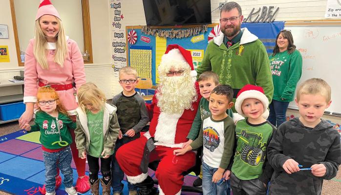 Santa and his elves, aka CPS administrators, visited the classrooms on Monday, spreading Christmas cheer throughout the building (LOCAL Photo courtest CPS).