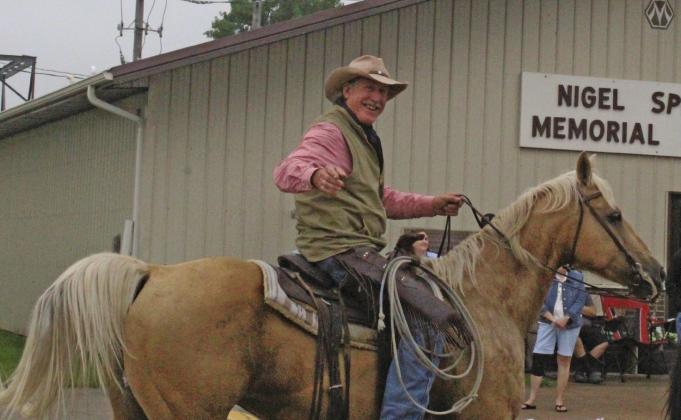 Jim Jenkins rode through the Callaway Pioneer Picnic parade following a float commemorating his family's 150th year on the ranch near Callaway. (Courier photo by Ellen Mortensen)