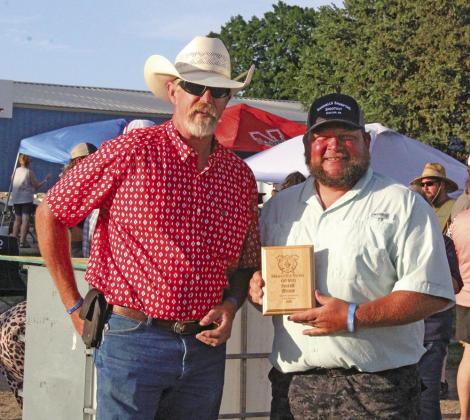 Oconto Fire Chief Cliff Badgley presents the Overall BBQ Champion award to Vest Ranch. (Courier photos by Ellen Mortensen)