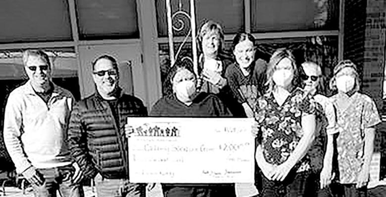 Presenting the check to the staff of Callaway Good Life Center are foundation members, from left, Mike Reiff and Henry Moore. (Photo courtesy Christie Pitkin)