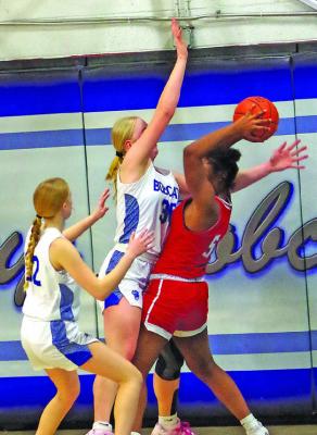 Emma Stallbaumer (#30) and Gracie Brennan (#32) put pressure on the Hi-Line ball handler in last week’s contest. (Courier photos by Ronda McFate)