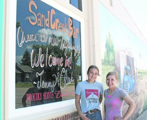 Jenny Robinson, right, her daughter Bindi, left, and husband Clint (not pictured) have taken ownership of Henry's Bar in Callaway, now Sand Creek Bar - open and ready to serve the public. (Courier photo by Ellen Mortensen)