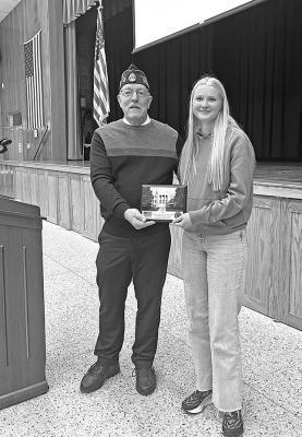Custer County Legion Commander Bill Schaad presents a plaque to Callaway High School senior Chenney Dishman, recognizing CHS as having the most participation in County Government Day on Nov. 17. (Courtesy photo)